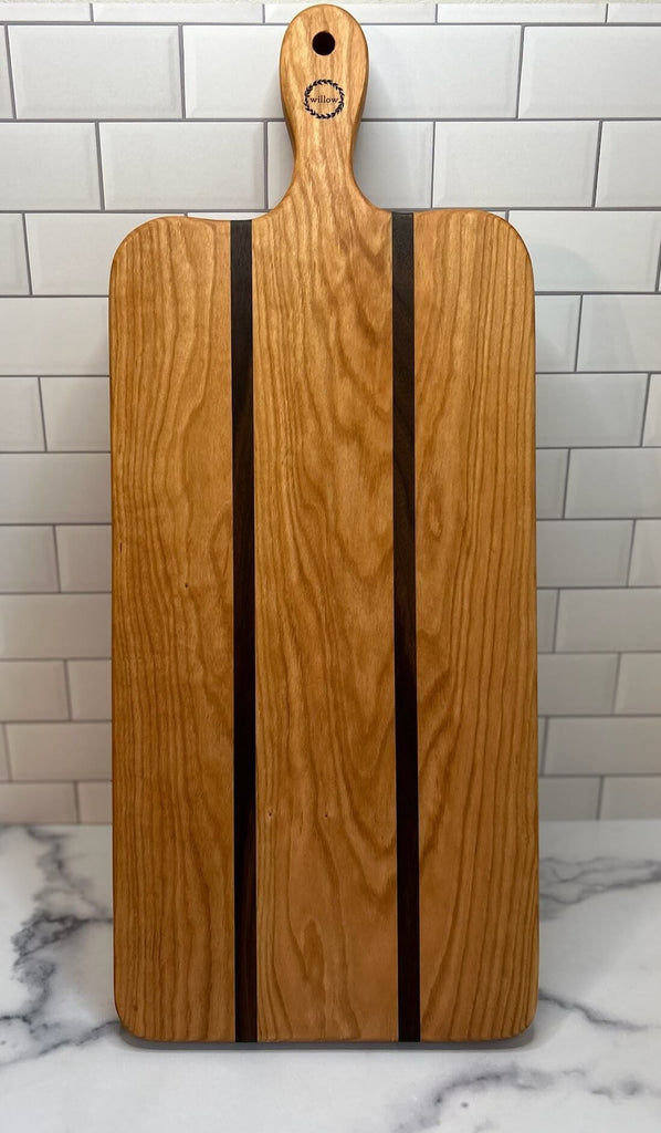 Willow Cherry Wood Charcuterie Board standing.