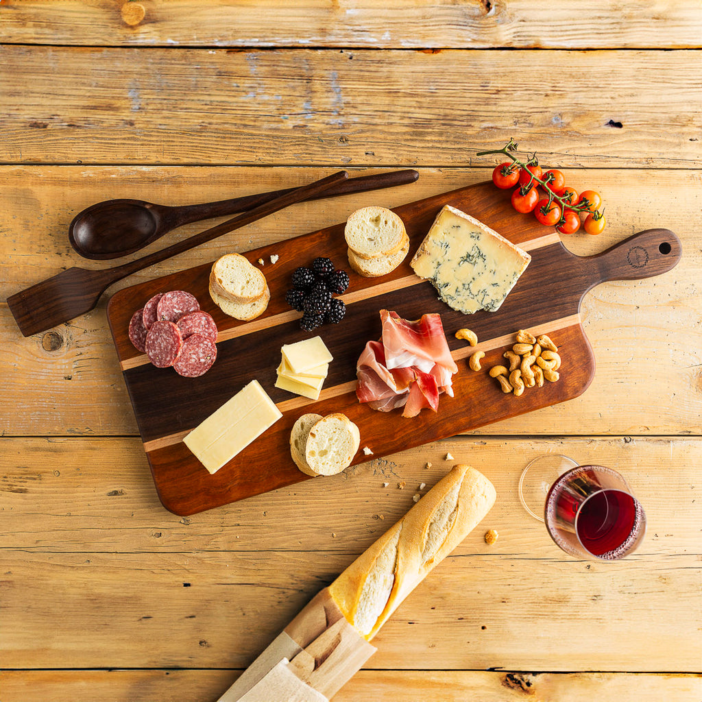 Wood Charcuterie serving cured meats, Vermont Cheese, fruit, nuts and bread.