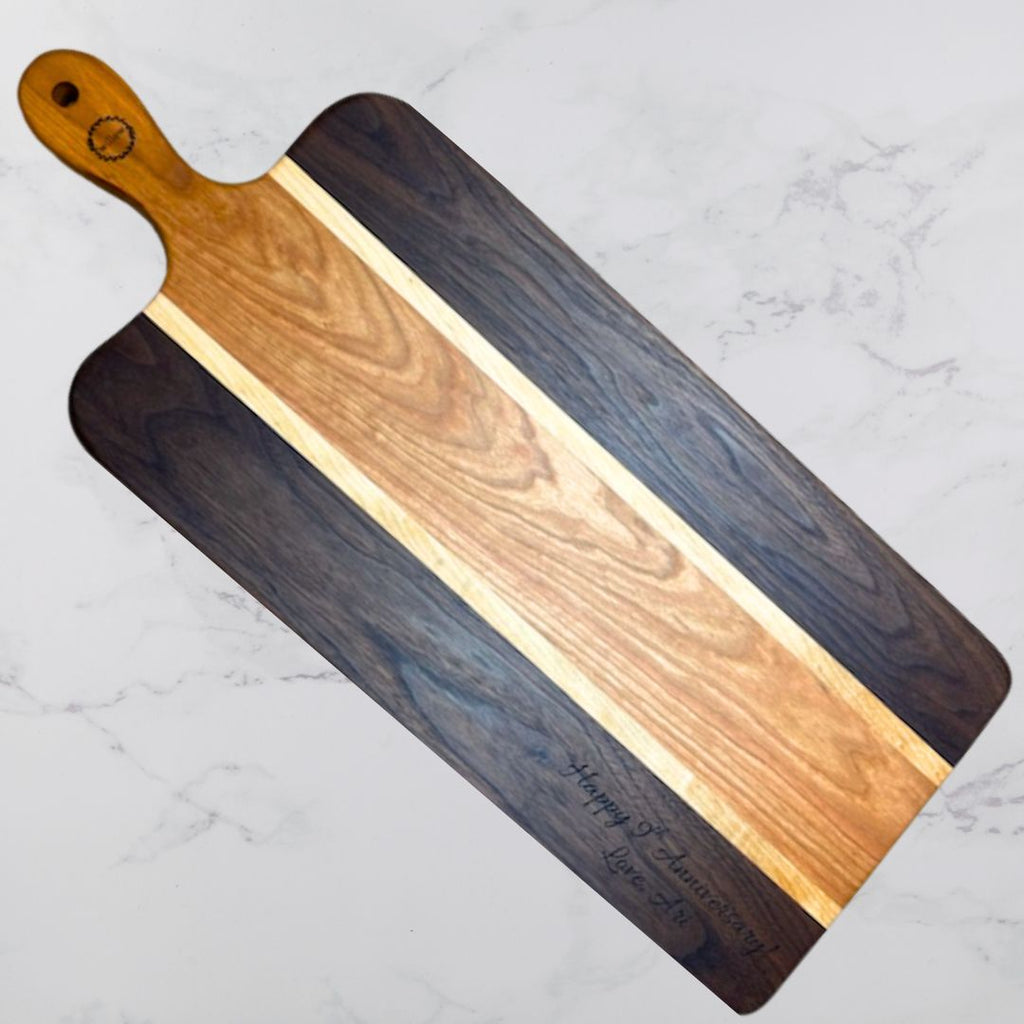 Walnut and Cherry Handmade Charcuterie Board with personalized engraving.