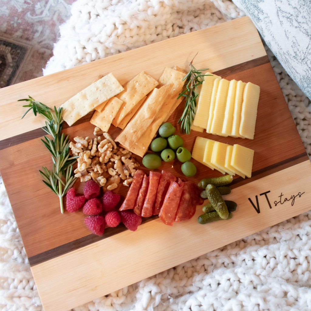 Engraved Wood Cutting Board made of Vermont Cherry and Maple with charcuterie spread.