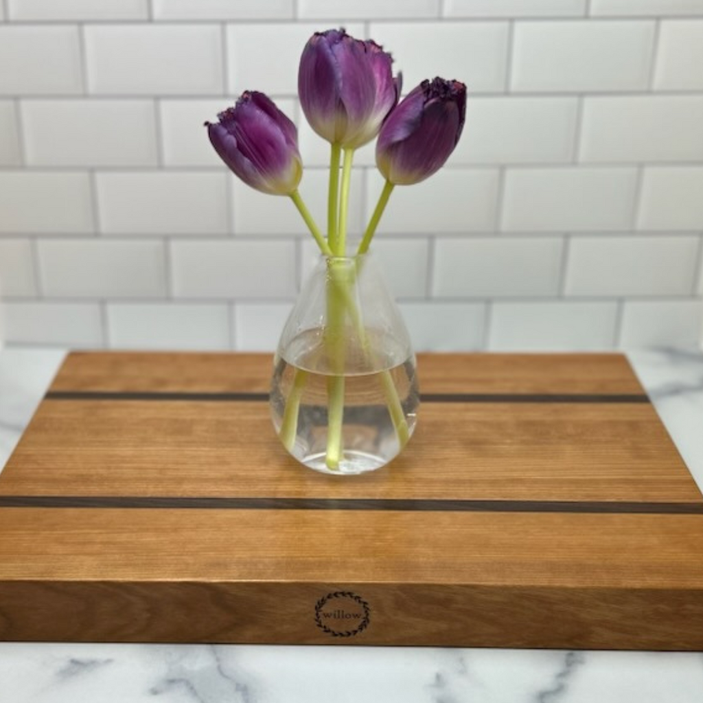 Vase of purple tulips on Willow Vermont Cherry Wood Cutting Board 