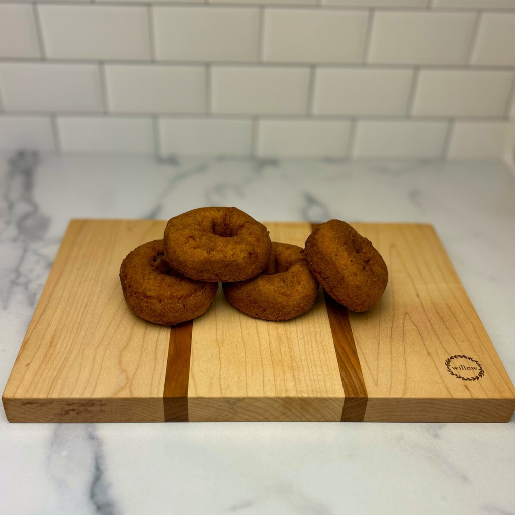 Homemade cider donuts on a Vermont maple cheese board. 