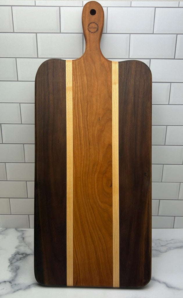 Willow Wood Charcuterie Board standing up.