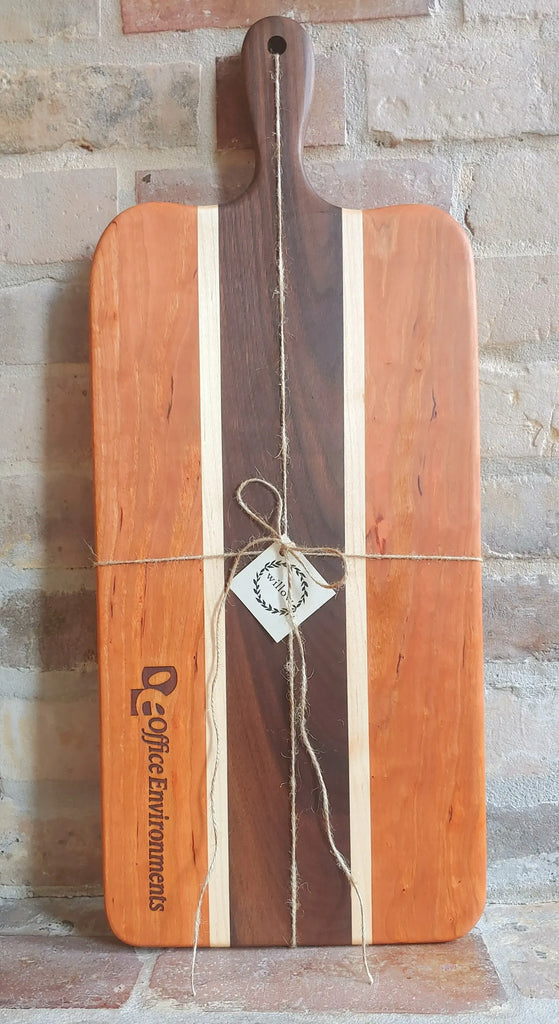 Personalized Wood Charcuterie board on old brick fireplace.